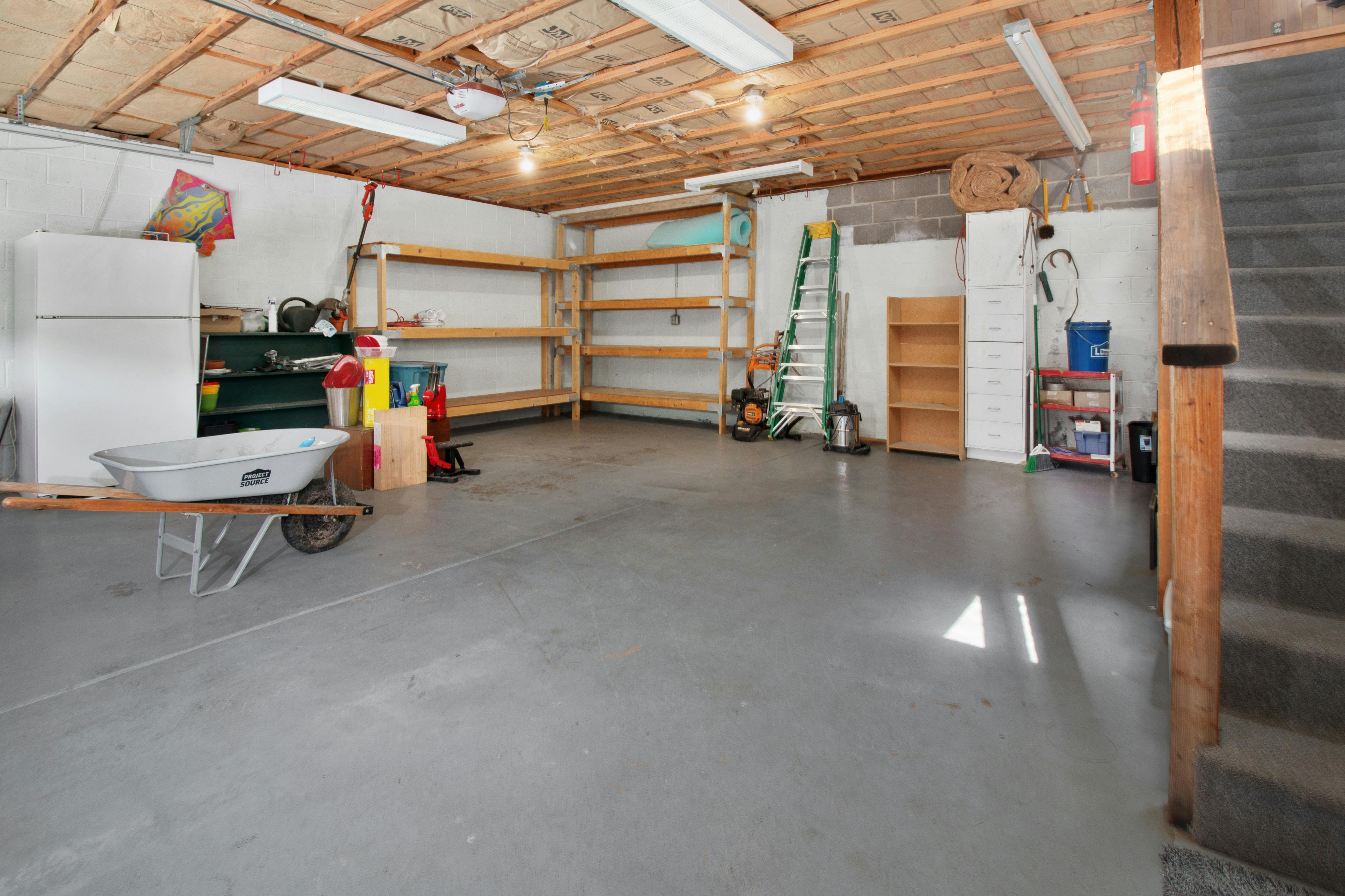Cleaning a garage floor with a leaf blower