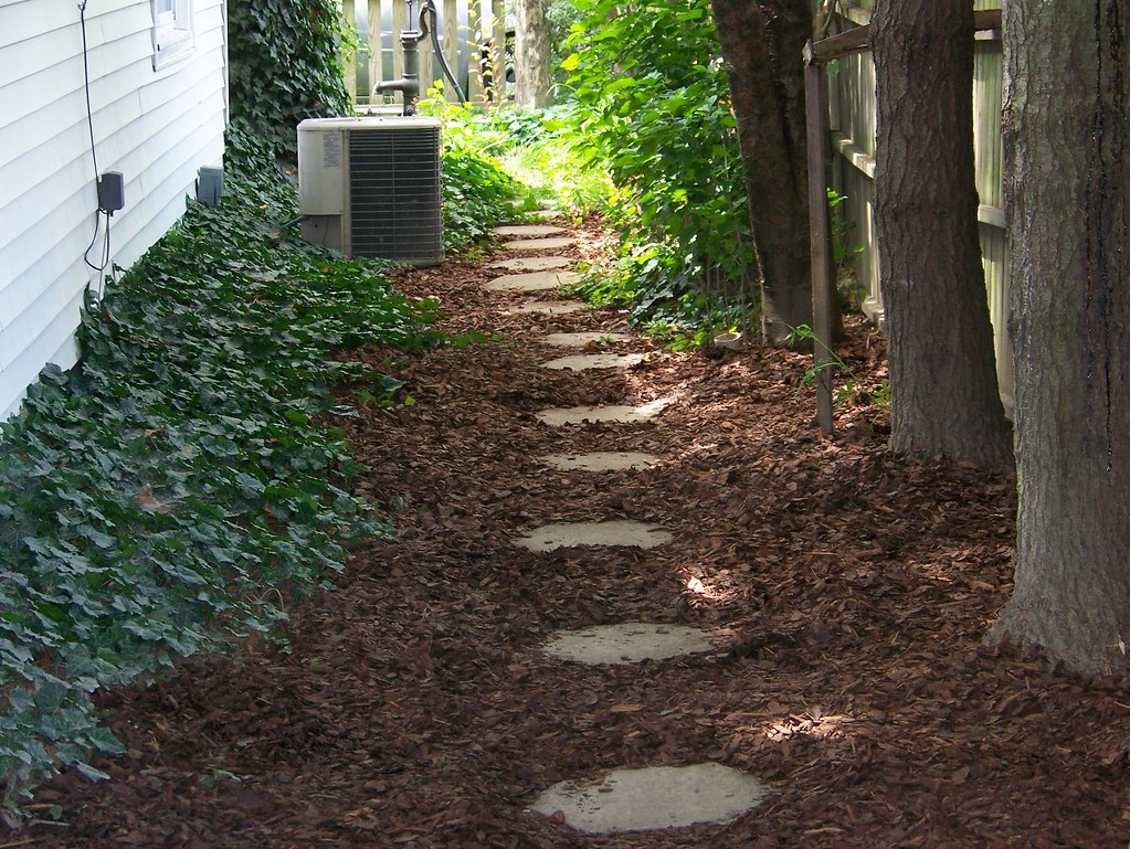 Mulch bed with leaves requiring controlled blower technique